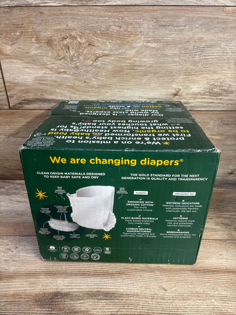 Front view of HealhtyBaby 56 ct size 3 diaper box showing the We are changing diapers headline on a wood background