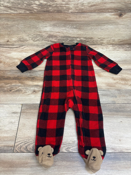 Front view of Carter’s red and black buffalo plaid blanket sleeper showcasing bear-face footies and front zipper on a wood floor