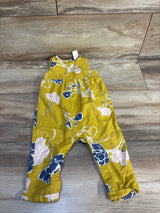 Yellow floral baby romper with blue and pink flowers on wooden floor