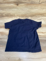 Navy blue short sleeve toddler t-shirt on wood background, children's clothing