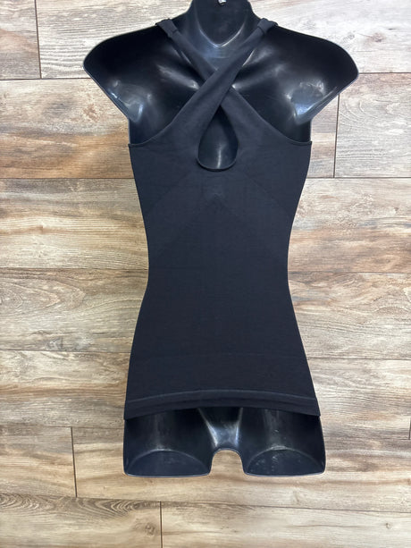 Front view of Blanqi maternity crossback tank with crossed straps, front keyhole and fitted black body on wood background