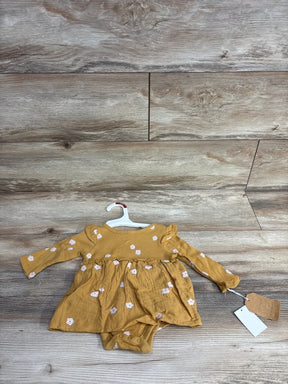 Mustard yellow long sleeve baby dress with small white floral print and attached bodysuit