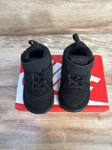 Black Nike baby sneakers on red box, ideal for kids' footwear resale