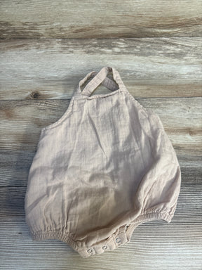 Flat lay of Siix sleeveless bubble romper, 12 months, showing cross-back straps, snap crotch closures and elasticized leg openings on wood floor