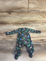 Flat lay of grey preemie dinosaur sleeper showing long sleeves, built-in feet, and green-blue dinosaur print on wood plank background