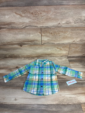 Front of Cat & Jack green plaid button-up shirt size 3T showing long sleeves, chest pocket, and buttons on wooden floor