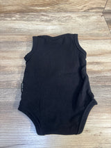 Black sleeveless baby bodysuit on wood floor, kids clothing resale product