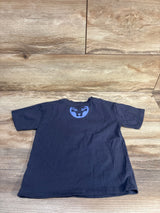 Back view of navy Marvel Black Panther toddler T-shirt, size 3T, showing blue panther face emblem at upper back on wood background