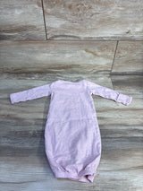 Flat lay of Simple Joys Bunny newborn pink sleep gown showing long sleeves and gathered elastic hem on wood floor background