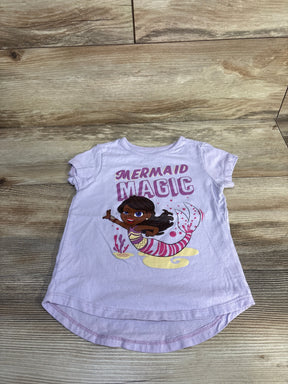 Front view of lilac girls Nickelodeon mermaid shirt with MERMAID MAGIC text and mermaid graphic on wood floor