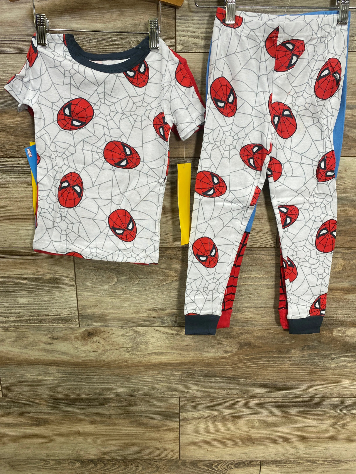 Children's Spider-Man pajama set with red mask print and spider web design on white background