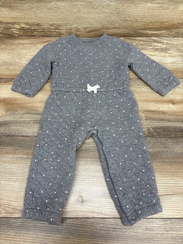 Front view of Carter’s gray quilted coverall with pink dots, white waist bow, and snap closures on wood background