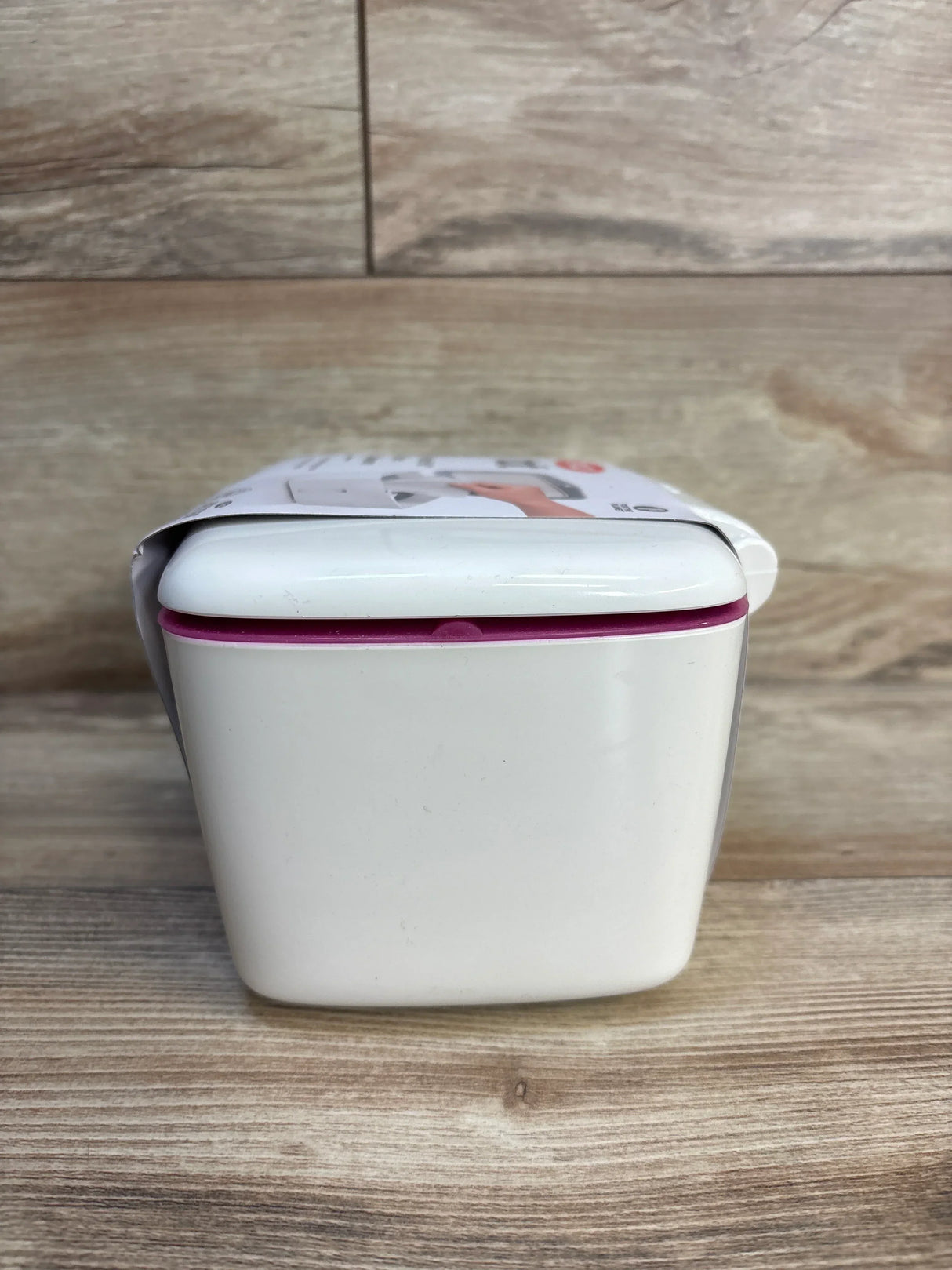 White baby wipe dispenser with purple seal, ideal for maternity and baby gear essentials