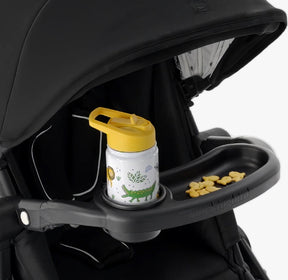Front view of Mockingbird Snack Tray showcasing bottle holder and snack compartment attached to a black stroller