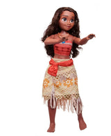 Front three-quarter view of 32-inch Moana doll, long curly hair, red top, patterned skirt, blue pendant on white background