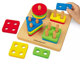 Angled top view of Lakeshore Sort-A-Shape activity board showing four colorful shape stacks and a child's hand on white