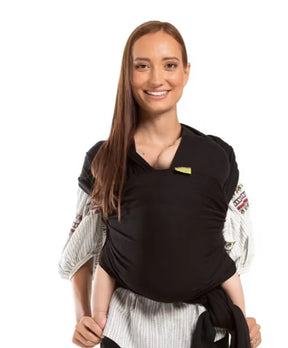 Front view of Boba Classic baby wrap (black) showcasing snug front infant carry with fabric tied at waist on smiling model