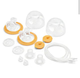 Clear and orange replacement parts for a baby breast pump including valves, membranes, tubing, and caps