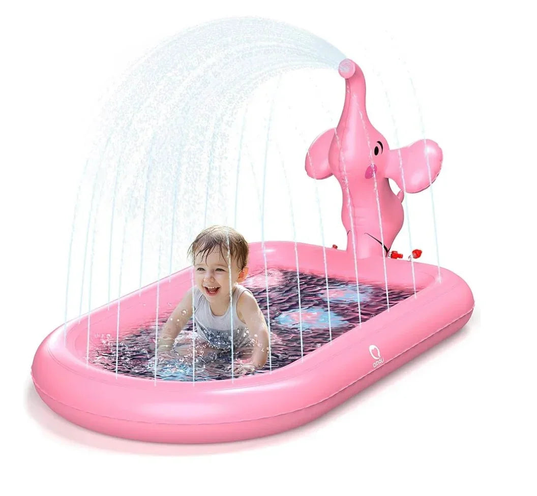 Front view of pink elephant inflatable splash pad pool showing arched sprinkler spray and toddler playing inside