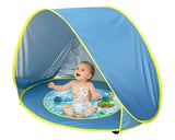 Baby playing in blue pop-up splash pool with shade tent, perfect for outdoor water fun and sun protection.