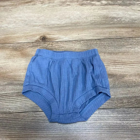 Top view of blue Cat & Jack bloomers size 0-3 months showing ribbed fabric, elastic waistband and cuffs on wood