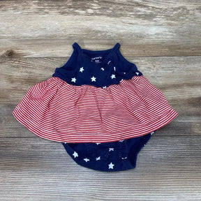 Flat-lay of Carter's size 3M navy sleeveless bodysuit dress with white stars and red-striped skirt on wood background