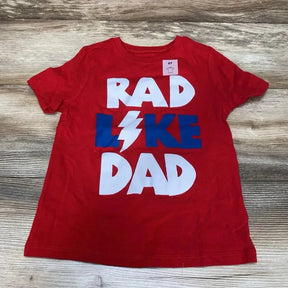 Flat lay of Old Navy red toddler T-shirt (size 5T) showcasing large white and blue "RAD LIKE DAD" graphic on wood background