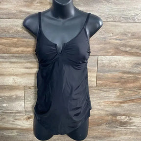 Front view of black maternity swim top on mannequin, small, V-notch bust, thin straps and ruched sides against wood background