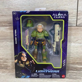Front view of Darby Steel action figure in Lightyear packaging showing green armor, helmet, and two weapons on wood background