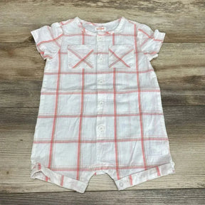 Flat lay, white and pink plaid shortie romper (12M) with buttons, chest pockets, short sleeves, and snap crotch on wood background