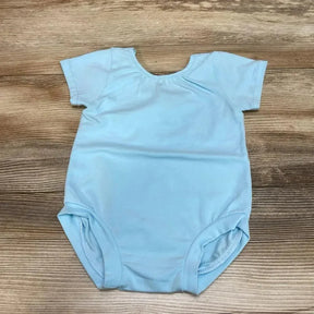 Flat lay of blue baby bodysuit 12m showing short sleeves, scoop neck and elastic leg openings on wood background used