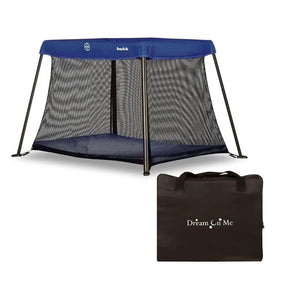 Angled view of Dream On Me travel playard, blue top, mesh sides and angled legs, with black carrying bag on white background