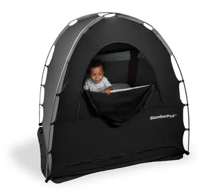 Baby in SlumberPod portable sleep tent for travel, safe and cozy baby gear
