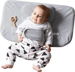 Front view of bbluv Ergo complete cushion set showing contoured headrest, padded waist strap, and side toy pocket on white background