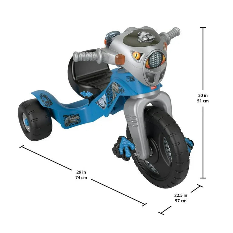 Three-quarter view of Fisher-Price Velociraptor tricycle, blue, dinosaur face and large front wheel, dims 29x20x22.5 in