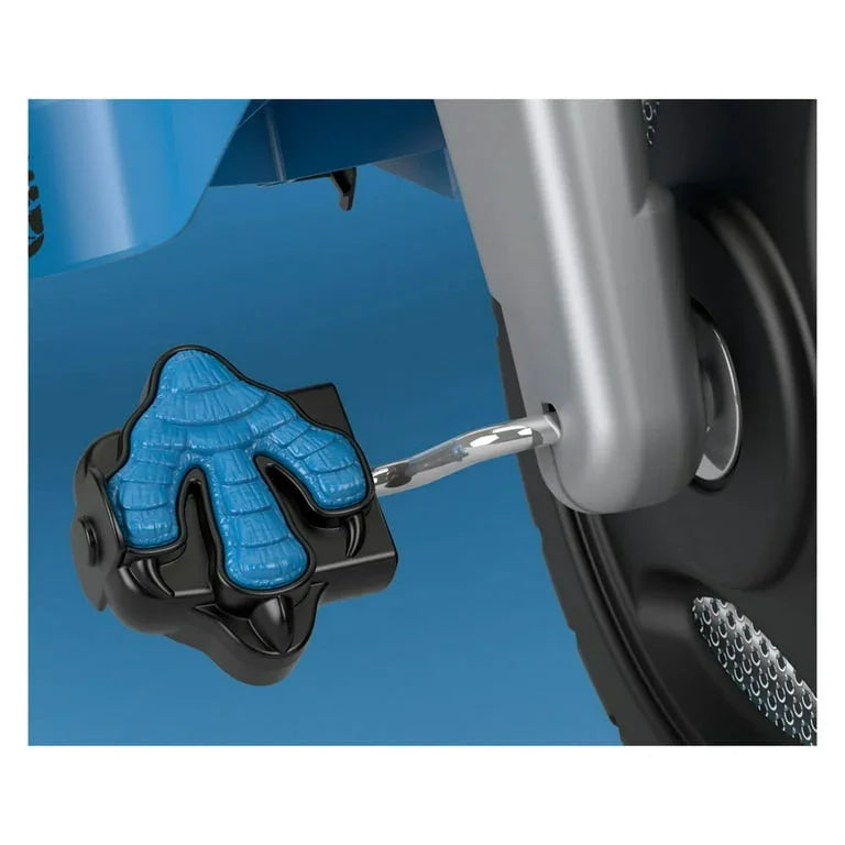 Close-up of Fisher-Price Jurassic World Velociraptor tricycle pedal showing blue claw-shaped textured pedal and metal crank