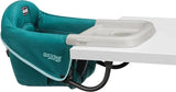Side view of Chicco QuickSeat hook-on chair with teal padded seat and gray tray clamped to a white table