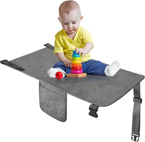 Front view of Cozybonder toddler airplane seat extender with center leg flap, adjustable buckle strap and grey padded surface