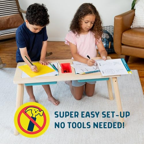 Two children draw and color at the sensory table art desk with super easy setup and no tools needed