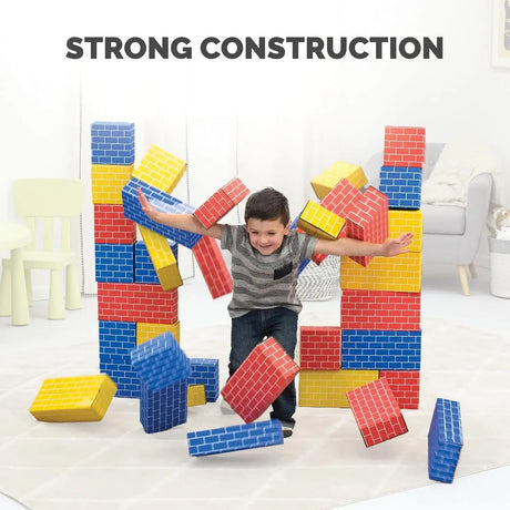 Child playing among colorful cardboard building blocks beneath the headline Strong Construction