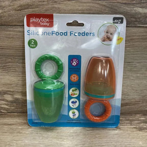 Front view of two-pack Playtex silicone food feeders, green and orange with protective caps on wood background