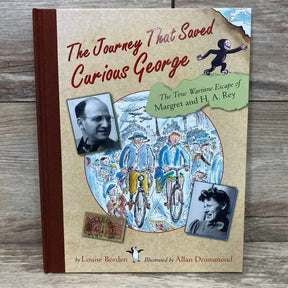 Front of hardcover 'The Journey That Saved Curious George' showing title, illustrated cover, and author photos on wood