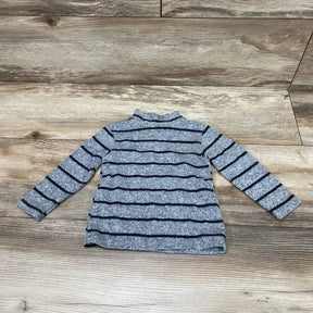 Flat lay of Zara grey baby shirt (6 to 9 months) showing navy stripes and mock turtleneck on wood background