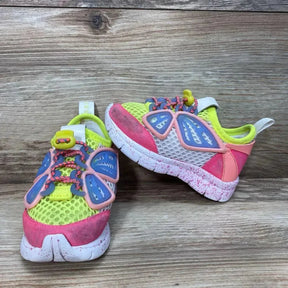 Front and side view of Sophia Webster Mini Chiara sneakers with yellow mesh, pink toe, blue butterfly accents on wood