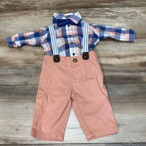 Front flat lay of baby plaid button-up shirt with navy bow tie, striped suspenders and peach pants on wood background